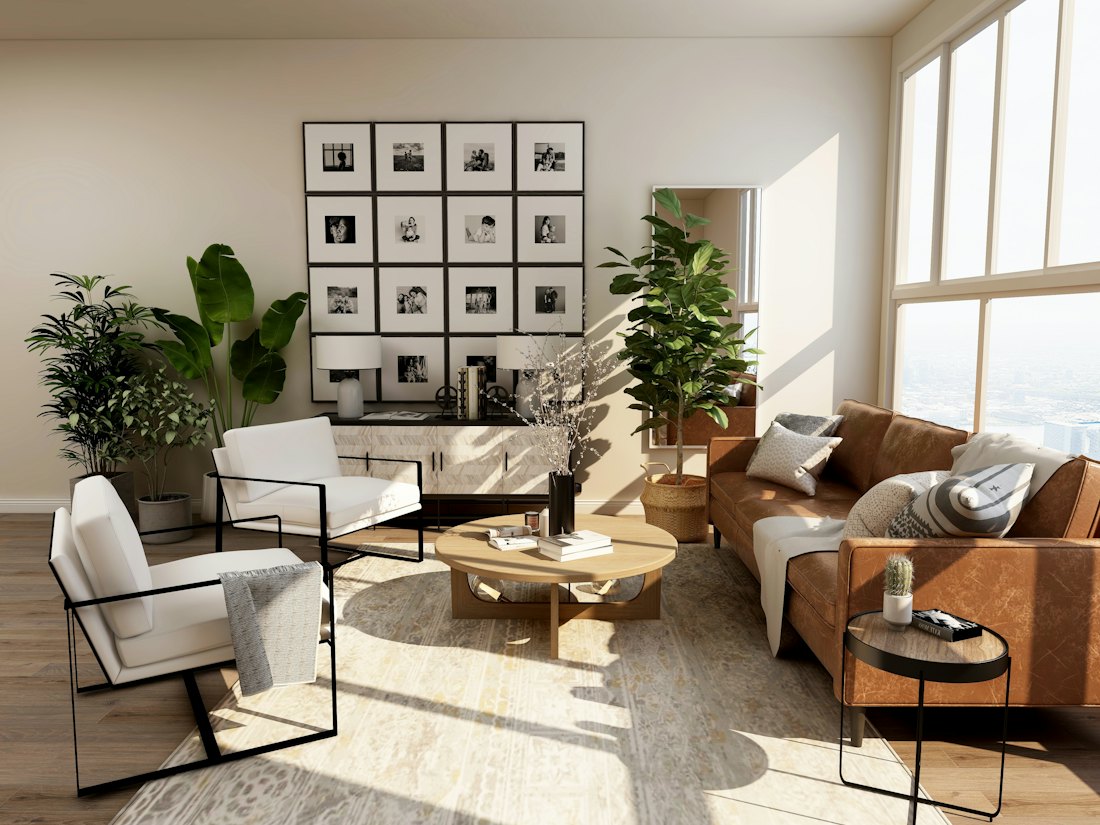 Sunlit living room with a gallery wall and leather sofa