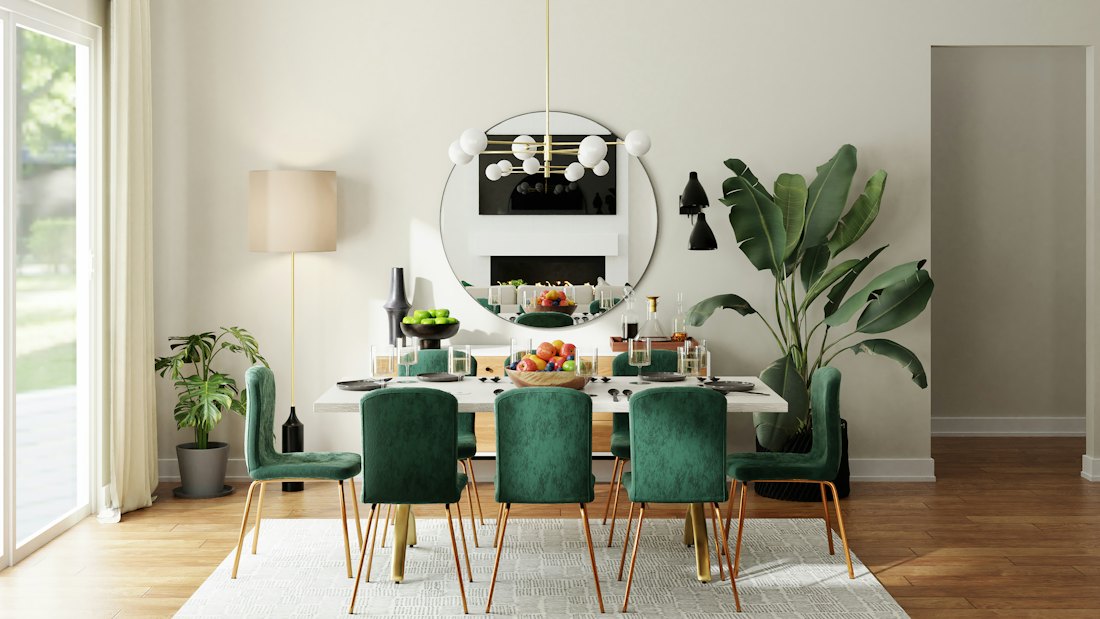 Dining room with emerald velvet chairs and a globe chandelier